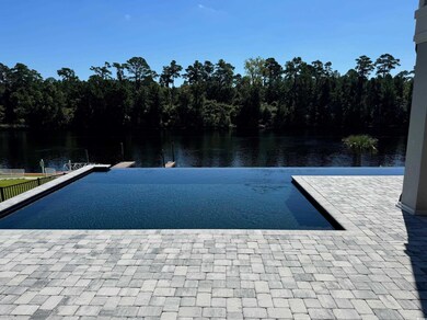 View of swimming pool featuring a water view