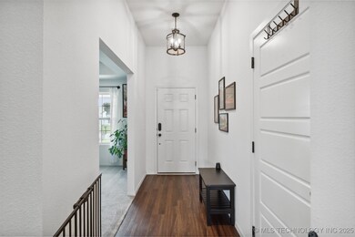 Entryway, bonus room/formal dining room to the lef