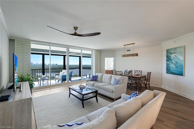 Living area with wood finished floors, a ceiling f