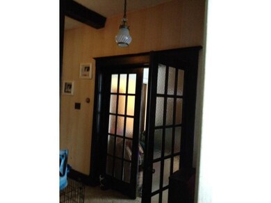 Entry/Foyer. Original French doors leading into th