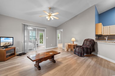 Living room featuring light wood-type flooring, va
