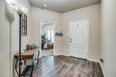Foyer with dark hardwood / wood-style floors
