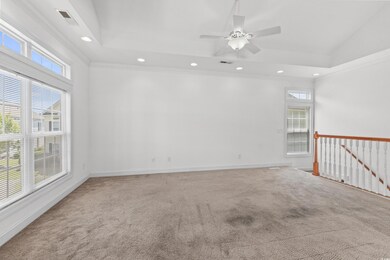 Unfurnished room featuring ceiling fan, carpet, or