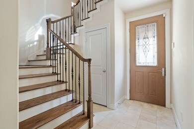 1st floor stairway has wood floors; wrought iron a