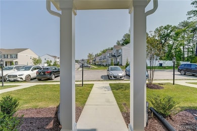 View of green lawn with a residential view