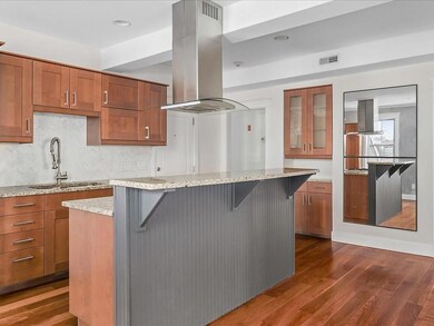 Kitchen w stone countertops and stainless steel ap