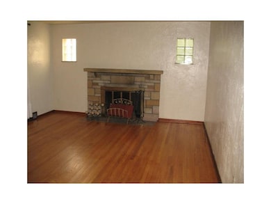 Living Room. STONE WOOD BURNING FIREPLACE.