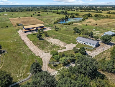 Aerial view of sparsely populated area featuring a large body of water