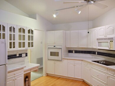 KITCHEN WITH WALL OVEN AND COOKTOP