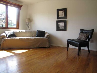 Living Room. A light filled living room with hardw