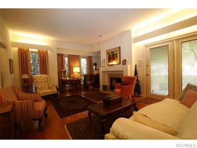 Floor to ceiling windows and door with side light that opens to patio fills the living and dining rooms with light.