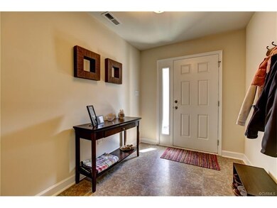 First floor entry leads to garage and second maste