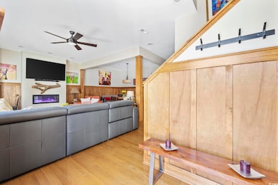 Living area with wooden walls, a wainscoted wall, 
