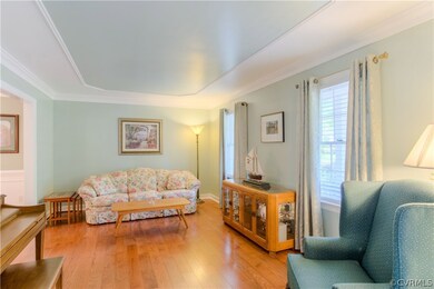 Living room with upgraded molding and new wood flo