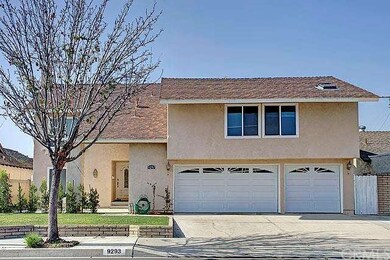 The front exterior features a grassy front with a 