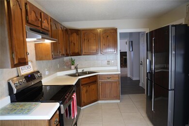 Updated Kitchen, tiled floor,  with built in desk/