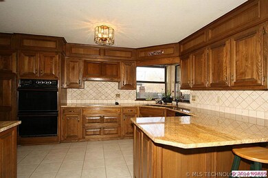 The updated kitchen has granite counters, a corner