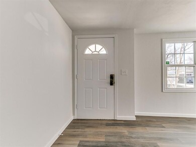 Foyer featuring a wealth of natural light and hard