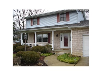 The beautifully shrubbed and landscaped yard are a
