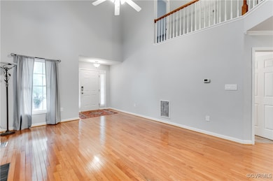 Foyer entrance featuring a towering ceiling, ceili