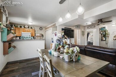 Dining area featuring dark wood-type flooring and 