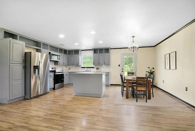 Open concept kitchen and dining.