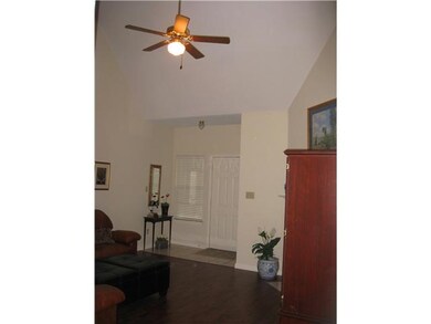den showing vaulted ceiling