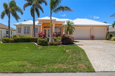 Ranch-style home with a garage, stucco siding, dri
