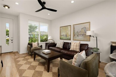 Living area featuring light wood-type flooring, recessed lighting, and a ceiling fan