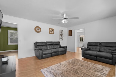 Living area featuring light wood-type flooring, ce