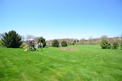 This is a side yard view which includes a small ch