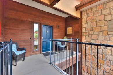 View of exterior entry featuring a balcony