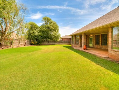 The backyard is large with mature trees.