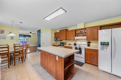 Kitchen featuring light tile patterned floors, a k