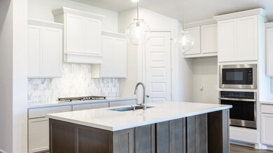 Kitchen featuring appliances with stainless steel