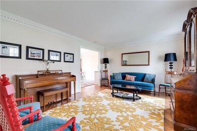 The large formal living room has hardwood flooring
