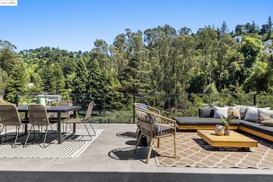 View of patio featuring an outdoor hangout area, outdoor dining area, and a forest view
