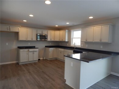 LOVELY HARDWOOD FLOORING IN KITCHEN, FOYER AND HAL