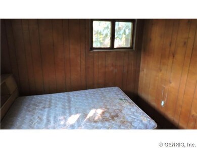 Bedroom. Smaller bedroom with full paneling.