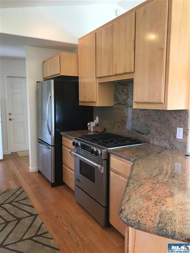 Granite backsplash and Electric oven below