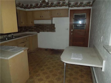 Kitchen. view of kitchen and side door to breezewa