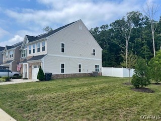 View of side of property featuring a garage