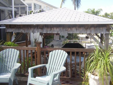 covered tiki hut on canal