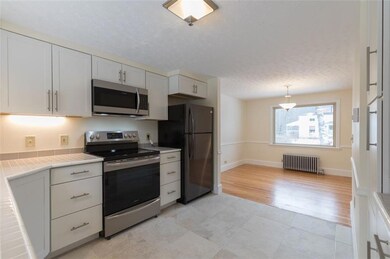 Kitchen opens to dining room