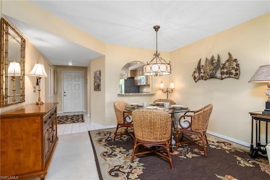 Dining area featuring light colored carpet