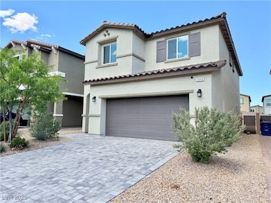 View of front of house with an attached garage, a