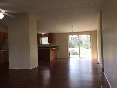 Living connects to Dining Area which Overlooks Huge Back Yard