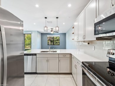 Kitchen featuring pendant lighting, sink, light ti
