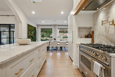 Kitchen with high end stainless steel range oven,
