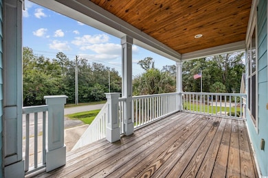 Wooden deck featuring covered porch